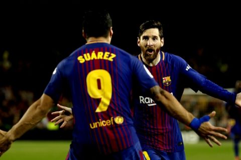 Barcelona's Lionel Messi, rear, celebrates with Barcelona's Luis Suarez after scoring his side's second goal during a Spanish La Liga soccer match between Barcelona and Real Madrid, dubbed 'El Clasico', at the Camp Nou stadium in Barcelona, Spain, Sunday, May 6, 2018. (AP Photo/Emilio Morenatti)