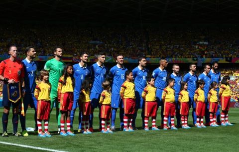 BELO HORIZONTE, BRAZIL - JUNE 14:  Greece players line up on the field before the 2014 FIFA World Cup Brazil Group C match between Colombia and Greece at Estadio Mineirao on June 14, 2014 in Belo Horizonte, Brazil.  (Photo by Paul Gilham/Getty Images)