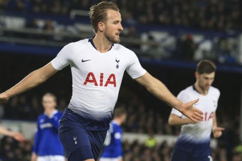 Tottenham's Harry Kane, left, celebrates with teammate Dele Alli after scoring during the English Premier League soccer match between Everton and Tottenham at Goodison Park Stadium, in Liverpool, England, Sunday, Dec. 23, 2018. (AP Photo/Jon Super)