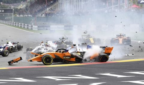 Mclaren driver Fernando Alonso of Spain, center, crashes at the start of the Belgian Formula One Grand Prix in Spa-Francorchamps, Belgium, Sunday, Aug. 26, 2018. (AP Photo/Geert Vanden Wijngaert)