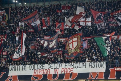 AC Milan fans display a banner reading "United in the sorrow of Astori's family, Rest in Peace" during the Europa League, round of 16 first-leg soccer match between AC Milan and Arsenal, at the Milan San Siro stadium, Italy, Thursday, March 8, 2018. (AP Photo/Antonio Calanni)