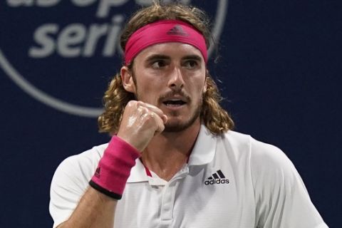 Stefanos Tsitsipas, of Greece, reacts to a point during his match with John Isner during the third round at the Western & Southern Open tennis tournament Tuesday, Aug. 25, 2020, in New York. (AP Photo/Frank Franklin II)