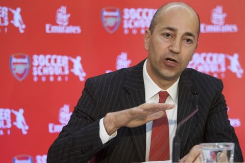 FILE - In this Thursday, May 21, 2009 file photo, Ivan Gazidis, CEO of Arsenal Football Club, speaks during the press conference announcing the partnership of Emirates and Arsenal Football Club in Dubai, United Arab Emirates. With the major honors set to elude Arsenal again in 2015, chief executive Ivan Gazidis says he is "not happy." And Gazidis fears Arsenal will find it harder in future just to maintain its perennial place in the top four Champions League qualification places due to a surge in television cash. (AP Photo/Nousha Salimi, File)