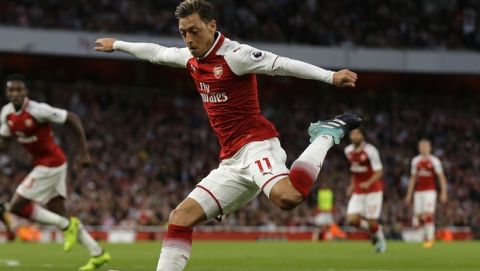 Arsenal's Mesut Ozil takes a shot on goal during their English Premier League soccer match between Arsenal and Leicester City at the Emirates stadium in London, Friday, Aug. 11, 2017. (AP Photo/Alastair Grant)