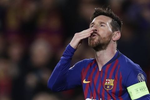 Barcelona forward Lionel Messi, celebrates after scoring his side's opening goal from a penalty spot during the Champions League round of 16, 2nd leg, soccer match between FC Barcelona and Olympique Lyon at the Camp Nou stadium in Barcelona, Spain, Wednesday, March 13, 2019. (AP Photo/Manu Fernandez)