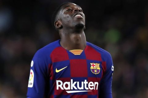 FILE - In this Nov. 9, 2019 file photo, Barcelona's Ousmane Dembele reacts during Spanish La Liga soccer match between Barcelona and Celta at the Camp Nou stadium in Barcelona. More than 17,000 fans were at the Camp Nou when Ousmane Dembele was officially introduced by Barcelona in 2017. The expectations were high at the time. Two and a half seasons later, though, Barcelona fans are still waiting for Dembele to meet all those expectations that came along with his signing. (AP Photo/Joan Monfort, File)