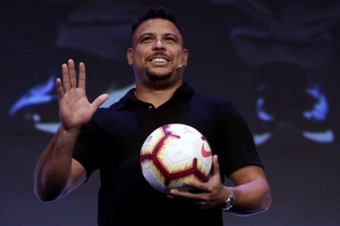 Former Brazilian soccer star Ronaldo Luis Nazario waves to the crowd before a conference of the World Football summit in Madrid, Spain, Tuesday, Sept. 25, 2018. (AP Photo/Manu Fernandez)