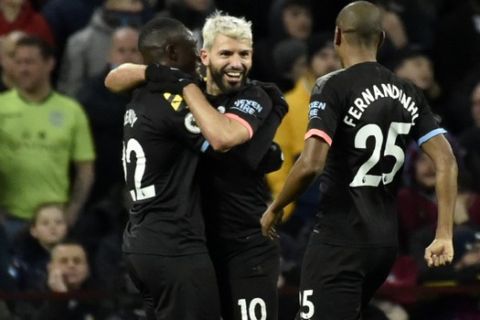 Manchester City's Sergio Aguero, center, celebrates with teammates after scoring his side's third goal during the English Premier League soccer match between Aston Villa and Manchester City at Villa Park in Birmingham, England, Sunday, Jan. 12, 2020. (AP Photo/Rui Vieira)