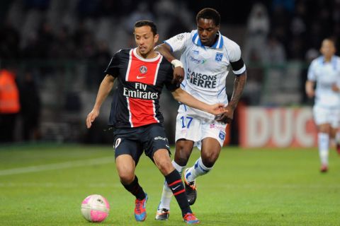 Paris Brazilian midfielder Nene (L) vies with Auxerre Cameroonian defender Georges Mandjeck during the French L1 football match Auxerre vs Paris-Saint-Germain, on April 15, 2012 at the Abbe Deschamps stadium in Auxerre. AFP PHOTO PHILIPPE MERLE (Photo credit should read PHILIPPE MERLE/AFP/Getty Images)