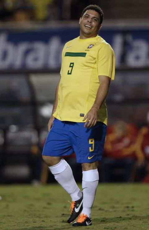 Brazil's retired striker Ronaldo gestures during his farewell match with the Brazilian team in a friendly soccer game with Romania in Sao Paulo, Brazil, Tuesday June 7, 2011. (AP Photo/Andre Penner)