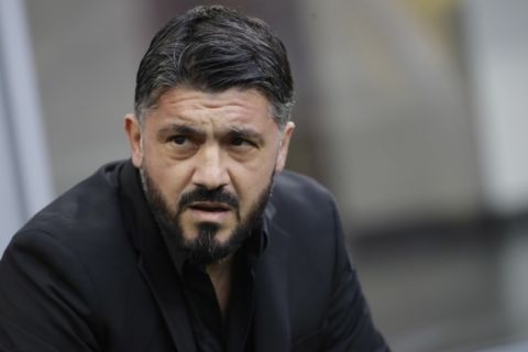 FILE - In this Saturday, Dec. 22, 2018 file photo, AC Milan coach Gennaro Gattuso waits for the start of a Serie A soccer match between AC Milan and Fiorentina, at the San Siro stadium in Milan, Italy. Amid reports of an imminent move to Chelsea and a mysterious fever, Gonzalo Higuain again lost his cool against his former club in what could have been his last match for AC Milan. Higuain was on the bench for most of Wednesday's Italian Super Cup against Juventus, officially due to "fever", but came on for the final 20 minutes. The Argentina forward had little impact and could not prevent 10-man Milan losing to Juventus but still made the headlines for the wrong reasons. (AP Photo/Luca Bruno, File )