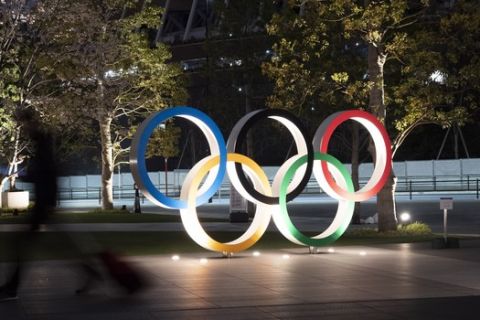 The Olympic rings are seen Monday, March 30, 2020, in Tokyo. The Tokyo Olympics will open next year in the same time slot scheduled for this year's games. Tokyo organizers said Monday the opening ceremony will take place on July 23, 2021. (AP Photo/Jae C. Hong)