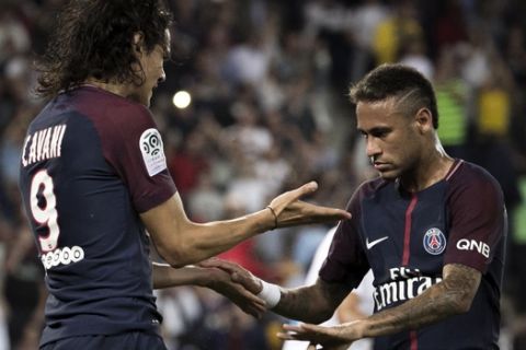 PSG's Edinson Cavani, left, reacts with teammate Neymar after a goal was scored, during the French League One soccer match between Paris Saint Germain and Saint Etienne at the Parc des Princes stadium in Paris, France, Friday, Aug. 25, 2017. (AP Photo/Kamil Zihnioglu)