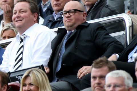Newcastle United's owner Mike Ashley, left, and managing director Lee Charnley, right, are seen in the stand ahead of their English Premier League soccer match between Newcastle United and West Ham United's  at St James' Park, Newcastle, England, Sunday, May 24, 2015. (AP Photo/Scott Heppell)