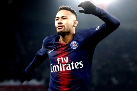 PSG's Neymar celebrates after scoring the opening goal during the League One soccer match between Paris Saint Germain and Guingamp at the Parc des Princes stadium in Paris, Saturday, Jan. 19, 2019. (AP Photo/Michel Euler)