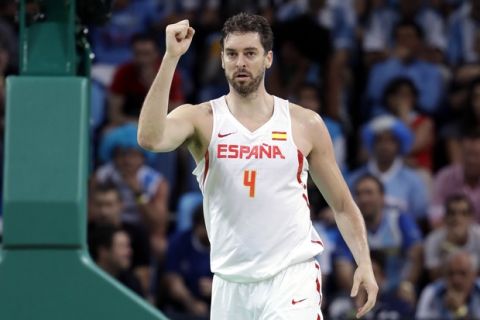 Spain's Pau Gasol (4) reacts to a score against Argentina during a men's basketball game at the 2016 Summer Olympics in Rio de Janeiro, Brazil, Monday, Aug. 15, 2016. (AP Photo/Eric Gay)