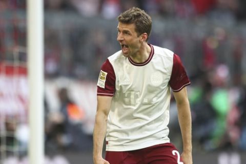 Bayern's Thomas Mueller celebrates after scoring his side's first goal during the German Bundesliga soccer match between FC Bayern Munich and FC Augsburg in Munich, Germany, Sunday, March 8, 2020. (AP Photo/Matthias Schrader)