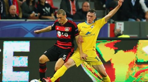 LEVERKUSEN, GERMANY - SEPTEMBER 16: Kyriakos Papadopoulos of Bayer Leverkusen is challenged by Nikolai Signevich of BATE during the UEFA Champions League Group E match between Bayer 04 Leverkusen and FC BATE Borisov at BayArena on September 16, 2015 in Leverkusen, Germany.  (Photo by Martin Rose/Bongarts/Getty Images)