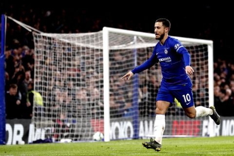 Chelsea's Eden Hazard celebrates after scoring his sides second goal during the English Premier League soccer match between Chelsea and Brighton & Hove Albion at Stamford Bridge stadium in London, Wednesday, April 3, 2019. (AP Photo/Frank Augstein)