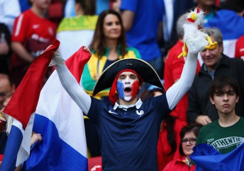 PORTO ALEGRE, BRAZIL - JUNE 15: A France fan cheers during the 2014 FIFA World Cup Brazil Group E match between France and Honduras at Estadio Beira-Rio on June 15, 2014 in Porto Alegre, Brazil.  (Photo by Ian Walton/Getty Images)