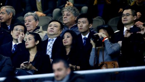 In this photo taken on Nov. 6, 2016, from left: Inter Milan CEO Liu Jun, Inter Milan Board of Directors members Ren Jun, Zhang Steven and Yang Yang attend a Serie A soccer match between Inter Milan and Crotone at the San Siro stadium in Milan, Italy. Next Sunday's will likely be Silvio Berlusconi's final derby as AC Milan owner. And the first for Inter's new Chinese proprietors.(AP Photo/Antonio Calanni)