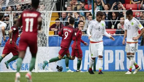 Portugal's Adrien Silva, center, celebrates after scoring his side's second goal during the Confederations Cup, third place soccer match between Portugal and Mexico, at the Moscow Spartak Stadium, Sunday, July 2, 2017. (AP Photo/Denis Tyrin)
