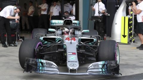 Mercedes driver Lewis Hamilton of Britain leaves his garage during qualifying at the Australian Formula One Grand Prix in Melbourne, Saturday, March 24, 2018. (Glenn Nicholls/Pool via AP)