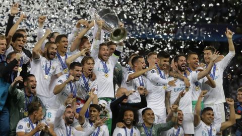 Real Madrid's Sergio Ramos lifts the trophy during the Champions League Final soccer match between Real Madrid and Liverpool at the Olimpiyskiy Stadium in Kiev, Ukraine, Saturday, May 26, 2018. (AP Photo/Efrem Lukatsky)