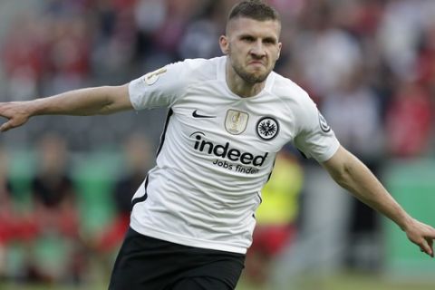 Frankfurt's Ante Rebic celebrates after scoring his side's opening goal challenge for the ball during the German soccer cup final match between FC Bayern Munich and Eintracht Frankfurt in Berlin, Germany, Saturday, May 19, 2018. (AP Photo/Michael Sohn)