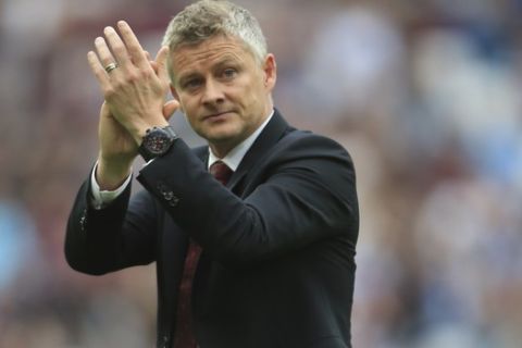 Manchester United's manager Ole Gunnar Solskjaer leaves at the end of the English Premier League soccer match between West Ham and Manchester United at London stadium in London, Sunday, Sept. 22, 2019. West Ham beat Manchester United 2-0. (AP Photo/Leila Coker)