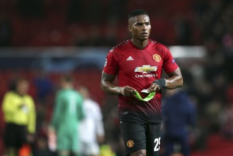 ManU defender Antonio Valencia leaves the field at the end of the Champions League group H soccer match between Manchester United and Valencia at Old Trafford Stadium in Manchester, England, Tuesday Oct. 2, 2018. (AP Photo/Jon Super)