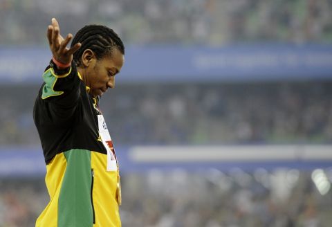 Jamaica's Yohan Blake poses with his gold medal during the medal ceremony for the Men's 100m at the World Athletics Championships in Daegu, South Korea, Monday, Aug. 29, 2011. (AP Photo/Martin Meissner)