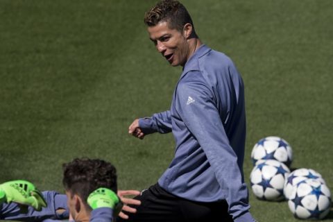 Real Madrid's Cristiano Ronaldo smiles during a training session in Madrid, Spain, Monday May 1, 2017. Real Madrid will play Atletico Madrid Tuesday in a Champions League semifinal, 1st leg soccer match Tuesday. (AP Photo/Paul White)