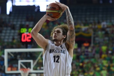 New Zealand's Isaac Fotu shoots the ball against Lithuania during Basketball World Cup Round of 16 match between New Zealand and Lithuania at the Palau Sant Jordi in Barcelona, Spain, Sunday, Sept. 7, 2014. The 2014 Basketball World Cup competition will take place in various cities in Spain from Aug. 30 through to Sept. 14. (AP Photo/Manu Fernandez)