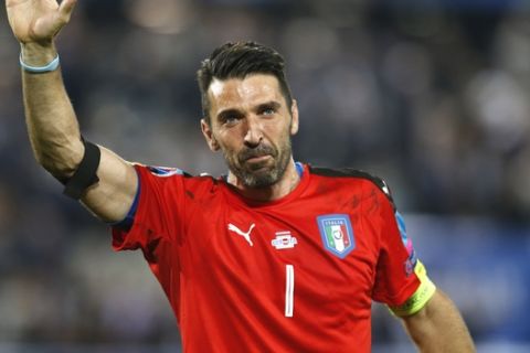 Italy goalkeeper Gianluigi Buffon waves as he leaves the pitch after losing the Euro 2016 quarterfinal soccer match between Germany and Italy, at the Nouveau Stade in Bordeaux, France, Saturday, July 2, 2016. (AP Photo/Michael Probst)