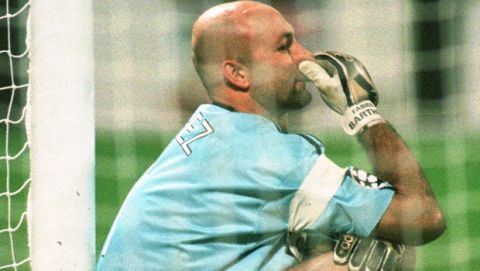 Monaco's goalkeeper Fabien Barthez takes a rest for the last ten minutes of the Champions League match Bayer Leverkusen vs. AS Monaco at the Ulrich Haberland-Stadium Wednesday, December 10, 1997. The match ended 2-2.(AP PHOTO/Roland Weihrauch)