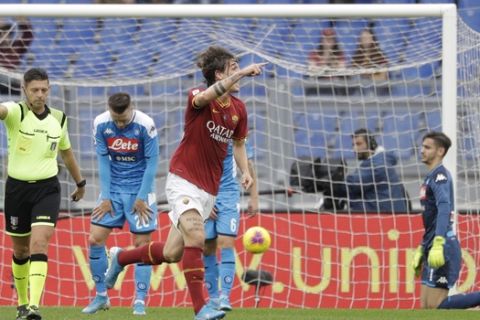 Roma's Nicolo Zaniolo celebrates after scoring his team's first goal during an Italian Serie A soccer match between Roma and Napoli, at the Olympic stadium in Rome, Saturday, Nov. 2, 2019. (AP Photo/Gregorio Borgia)