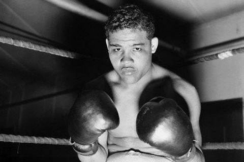 Original caption: 6/5/38- Pompton Lakes, NJ - Just take a look at these two mighty "pile drivers" which Heavyweight Champion Joe Louis exhibits in this unusual closeup at his training camp, here.  Louis is getting in trim to defend his title against Max Schmeling of Germany at the Yankee Stadium, June 22nd.  Former Champion James J. Braddock, whom Louis defeated for the title, visited the "Bomber" at his camp, today, and placed his stamp of appoval on the title-holder. June 5, 1938 Pompton Lakes, New Jersey, USA