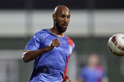 Former France striker Nicolas Anelka plays for the Mumbai City team during a practice match against the ONGC football team in Mumbai, India, Tuesday, Oct. 7, 2014. Anelka is expected to play for the Mumbai City team in the inaugural Indian Super League (ISL) which kicks off Oct. 12. (AP Photo/Rajanish Kakade)