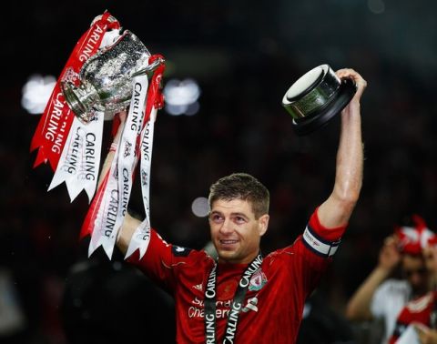 LONDON, ENGLAND - FEBRUARY 26:  Steven Gerrard of Liverpool celebrates with the trophy after victory in the Carling Cup Final match between Liverpool and Cardiff City at Wembley Stadium on February 26, 2012 in London, England. Liverpool won 3-2 on penalties.  (Photo by Paul Gilham/Getty Images)