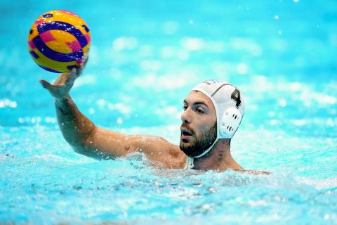 Greece's Efstathios Kalogeropoulos pass the ball during their men's water polo gold medal match against Greece at the World Swimming Championships in Fukuoka, Japan, Saturday, July 29, 2023. (AP Photo/Eugene Hoshiko)