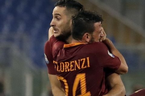 Romas Kostas Manolas, left, celebrates with teammate Alessandro Florenzi after scoring, during a Serie A soccer match between Roma and Inter Milan, at Rome's Olympic Stadium, Sunday, Oct. 2, 2016. (AP Photo/Andrew Medichini)