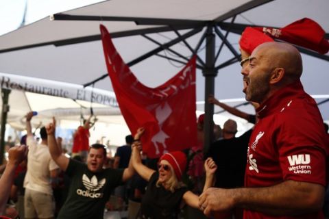 Liverpool fans sing at Plaza Mayor square in downtown Madrid, Spain, Thursday, May 30, 2019. Madrid will be hosting the final again after nearly a decade, but the country's streak of having at least one team playing for the European title ended this year after five straight seasons, giving home fans little to cheer for when Liverpool faces Tottenham at the Wanda Metropolitano Stadium on Saturday. (AP Photo/Manu Fernandez)