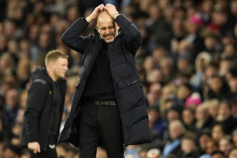 Manchester City's head coach Pep Guardiola reacts during the FA Cup quarterfinal soccer match between Manchester City and Newcastle at the Etihad Stadium in Manchester, England, Saturday, March 16, 2024. (AP Photo/Dave Thompson, Pool)