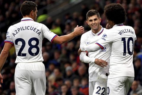 Chelsea's Christian Pulisic, center, celebrates scoring his side's first goal of the game during the English Premier League soccer match at Turf Moor, Burnley, England Saturday Oct. 26, 2019. (Anthony Devlin/PA via AP)