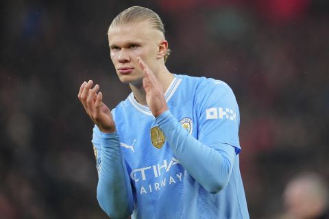 Manchester City's Erling Haaland applauds after the English Premier League soccer match between Liverpool and Manchester City, at Anfield stadium in Liverpool, England, Sunday, March 10, 2024. The match ended 1-1. (AP Photo/Jon Super)