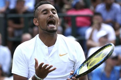 Nick Kyrgios of Australia, reacts as he plays Robin Haase of the Netherlands, during their men's singles match, on the fourth day of the Wimbledon Tennis Championships in London, Thursday July 5, 2018. (Jonathan Brady/PA via AP)