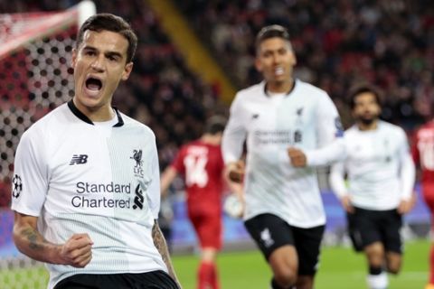 Liverpool's Philippe Coutinho, left, celebrates after scoring during the Champions League soccer match between Spartak Moscow and Liverpool in Moscow, Russia, Tuesday, Sept. 26, 2017. (AP Photo/Ivan Sekretarev)