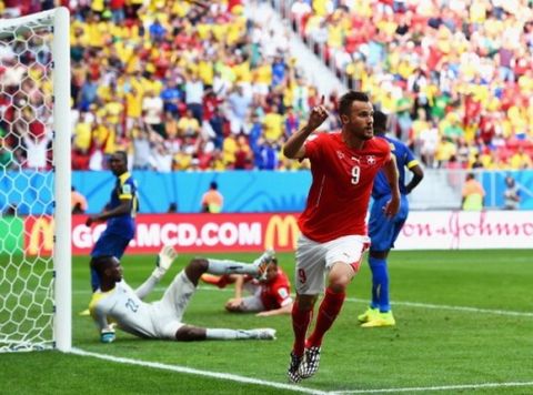 BRASILIA, BRAZIL - JUNE 15: Haris Seferovic of Switzerland celebrates scoring his team's second goal during the 2014 FIFA World Cup Brazil Group E match between Switzerland and Ecuador at Estadio Nacional on June 15, 2014 in Brasilia, Brazil.  (Photo by Stu Forster/Getty Images)