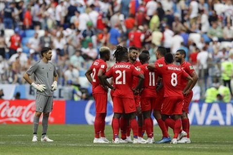 Panama players gather on the pitch at the end of the first half of the group G match between England and Panama at the 2018 soccer World Cup at the Nizhny Novgorod Stadium in Nizhny Novgorod , Russia, Sunday, June 24, 2018. (AP Photo/Alastair Grant)
